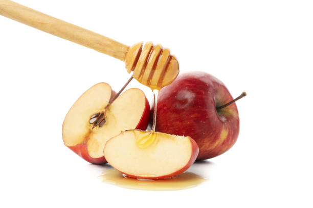 istock Apples, honey and dipper isolated on white background 1216348733