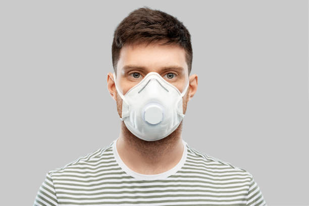 man in protective medical mask or respirator
