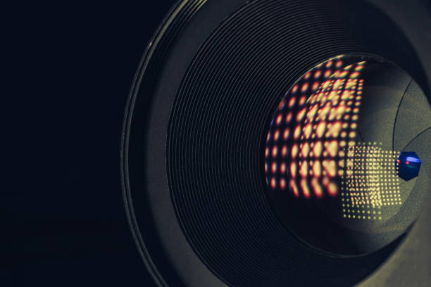 istock Close up beautiful camera aperture lens with multi colored light glass reflection. Macro view. 1216354866
