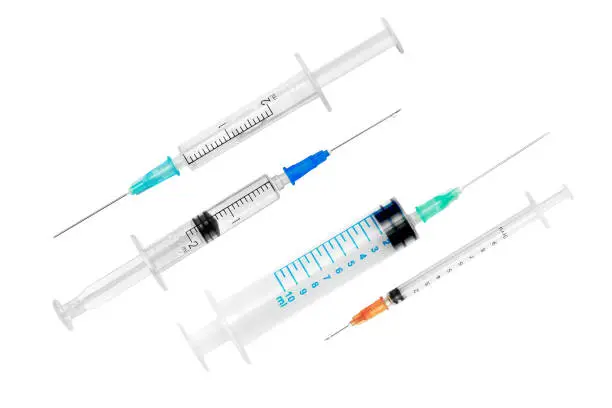 Photo of Various syringes isolated on white background