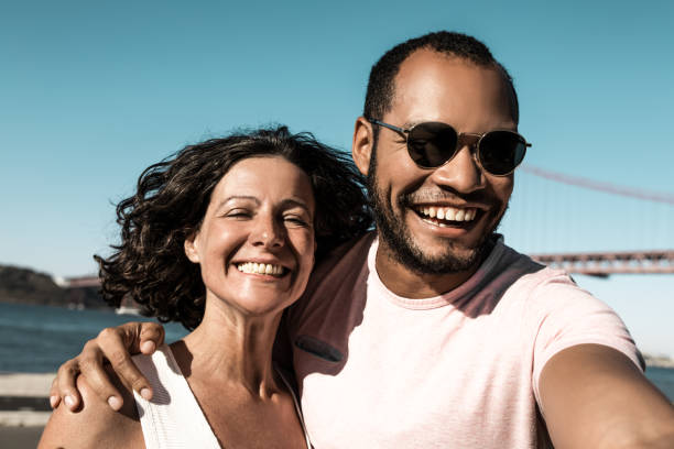 istock Young couple smiling at camera 1216356128