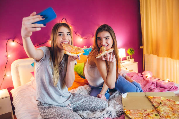 istock Eating pizza at slumber party 1216356317