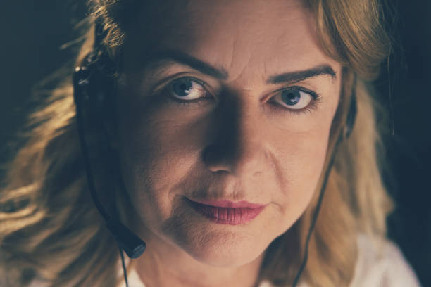 istock Serious businesswoman in headset looking at camera 1216357882