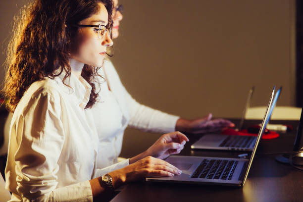 istock Professional businesswomen working with laptops 1216359160