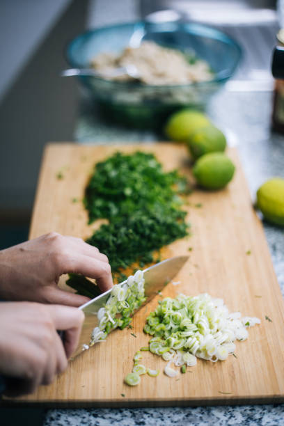 istock Slicing vegetables for salad 1216359682