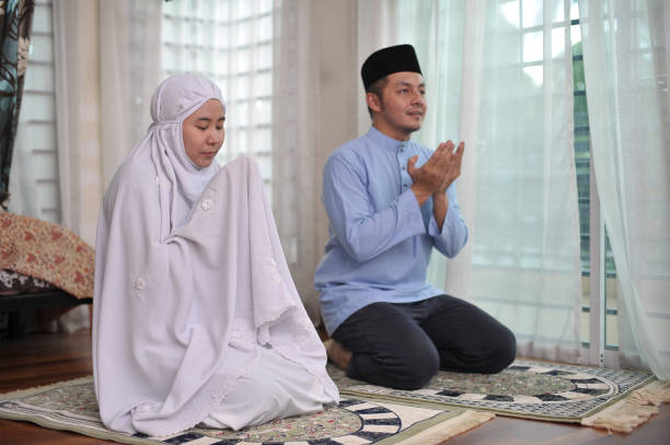 istock Asian family praying together during ramadhan 1216360544