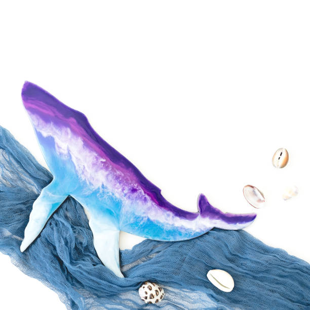 istock Resin art whale and fabric waves on white background. Flat lay, top view 1216360854