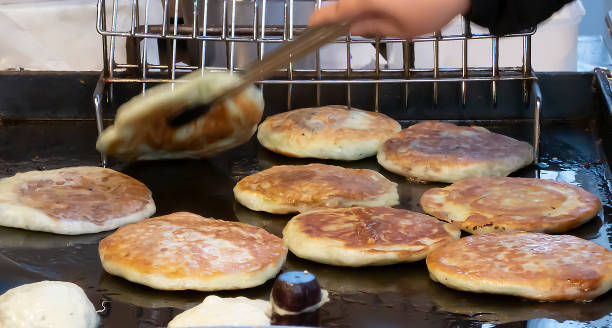 Korean traditional snack hotteok fried in oil