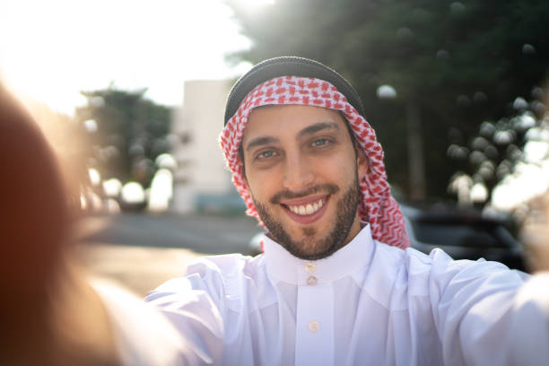 Arab Middle East man taking a selfie at street