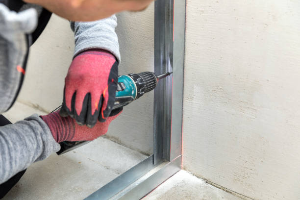 istock man fasten metal profile frame to the wall for draywall bulkhead 1216369404