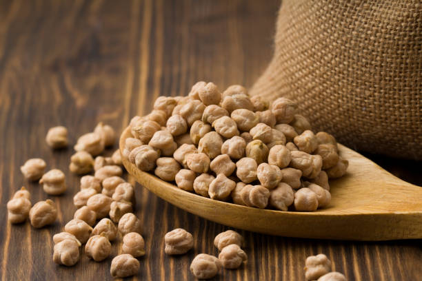 istock Organic raw chick peas, healthy vegan nutrition concept 1216371676
