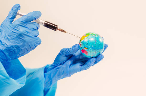 istock Virus. The doctor makes an injection to the planet earth. 1216376241