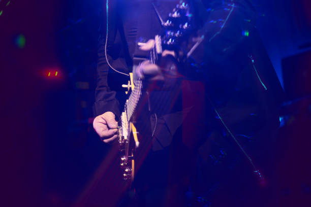 istock Guitarist playing guitar. Close up blurred background image 1216376657