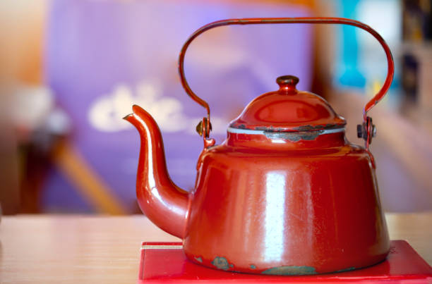 istock Old red metal coffee pot Currently 1216378022