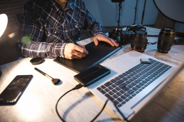 istock photographer man hand graphic tablet on desk 1216379335