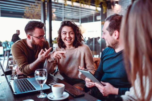 istock Friends Enjoying Talk About Technology Over Good Coffee 1216379826
