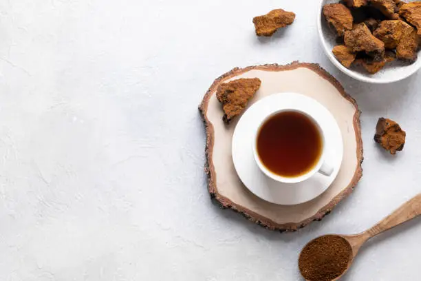 Photo of Organic Chaga mushroom coffee. Trendy healthy infusion.