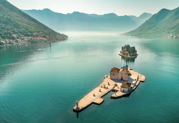 Aerial photo of St. George and monastery on the islands near Perast town in Kotor bay, Montenegro