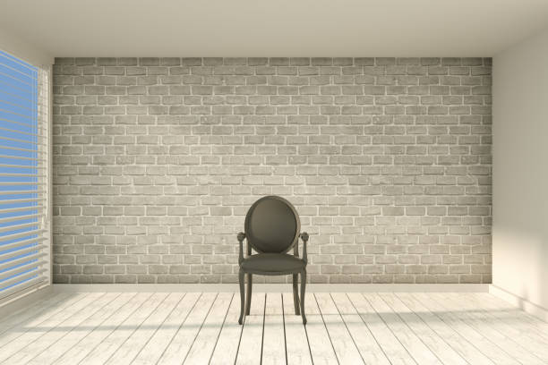 istock Empty Chair in Empty Room with Sunlight and Brick Wall 1216381586
