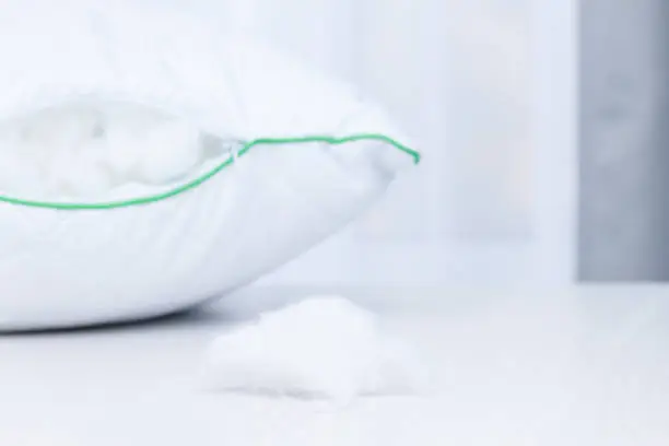 Hypoallergenic pillow with tinsulate or polyester filler. Allergy dust concept.