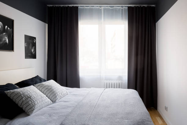 istock Stylish bedroom with big window 1216382525