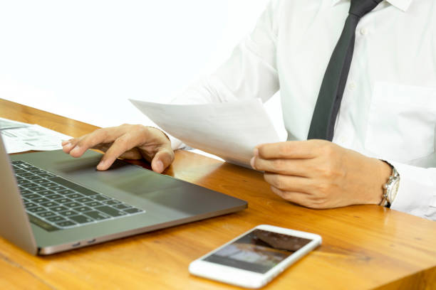 istock Businessman work on laptop analyze stock report in clipping path. 1216382636