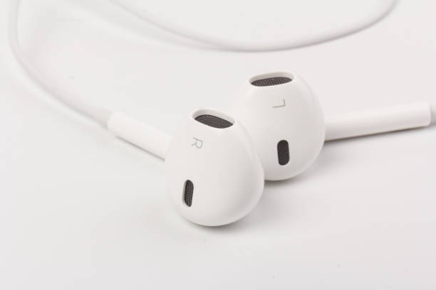 istock White headphones with headset on white isolated background 1216384233