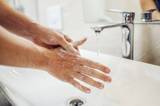 istock Washing hands rubbing with soap man for corona virus prevention, 1216384578