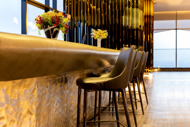 istock Interior design row of modern leather stools chair in luxury lounge. 1216385638