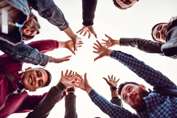 istock Friends Cheering Together Outside 1216385732