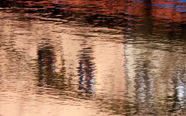 istock Reflection of a building on a corrugated water surface 1216386425