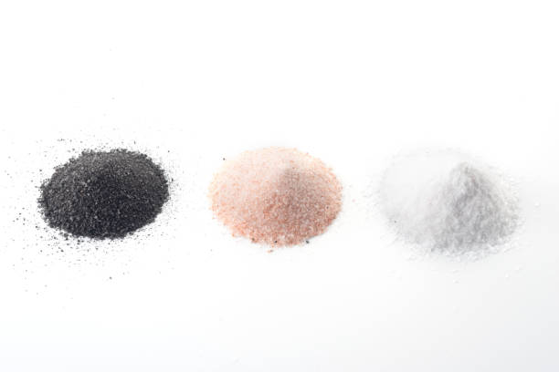 istock three types of salt lie on a white background - black, pink, white 1216386698