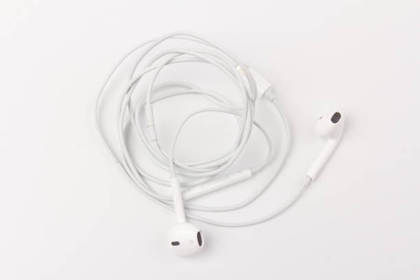 istock White headphones with headset on white isolated background 1216386828