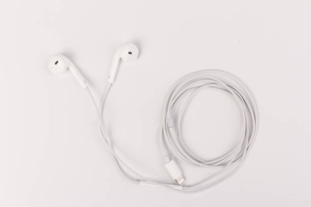 istock White headphones with headset on white isolated background 1216386854