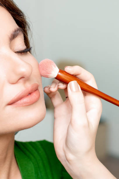 istock Makeup artist applies tonal. 1216388596