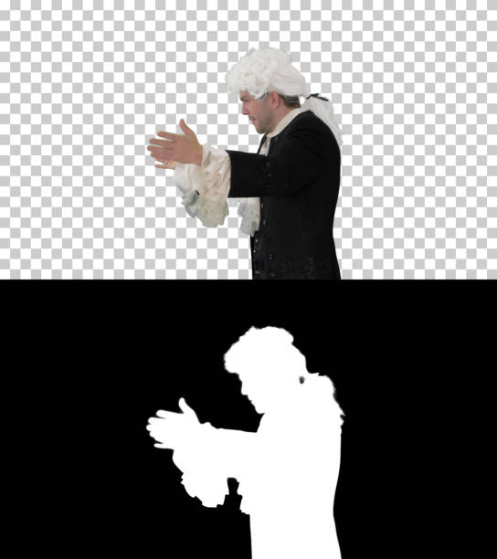 On Alpha Matte. Medium shot. Side view. Man dressed like Wolfgang Amadeus Mozart conducting an orchestra, Alpha Channel. Professional shot.