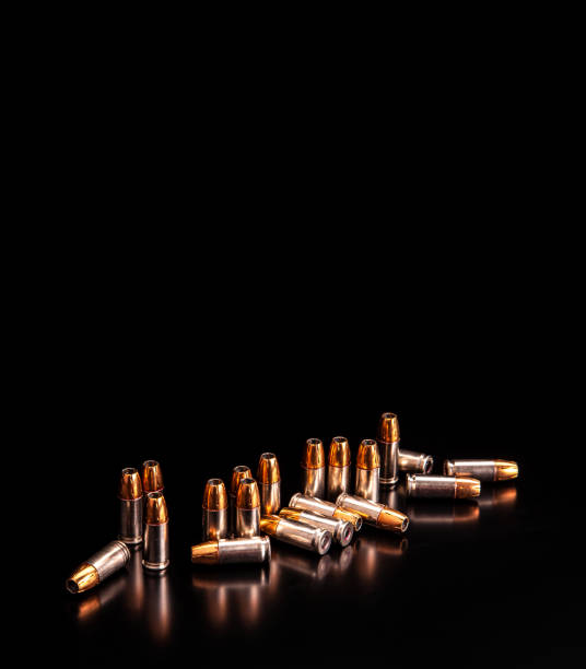 istock Bullet isolated on black background with reflexion. Rifle bullets close-up on black back. Cartridges for rifle and carbine on a black. 1216390098