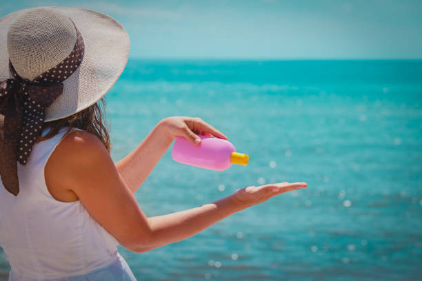 istock young woman with suncream on beach vacation 1216390152