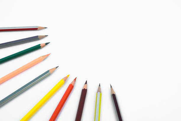 istock Bunch of different colored pencil crayon arranged in a circle shape all pointing the middle of a white background 1216390246