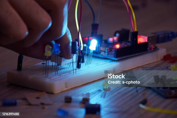 An Engineer Working On Opensource Hardware And Software Project Breadboard Electronic Module Stock Photo - Download Image Now