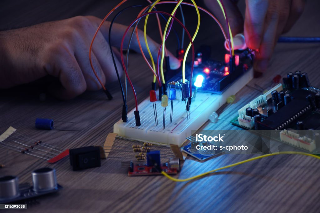 An engineer working on open-source hardware and software project, breadboard, electronic module CPU Stock Photo An engineer working on open-source hardware and software project, breadboard, electronic module CPU Stock Photo