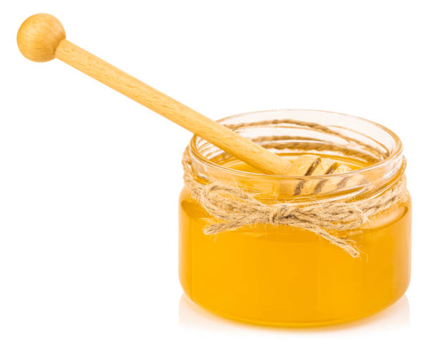 istock Honey pot and dipper isolated on white background 1216394493