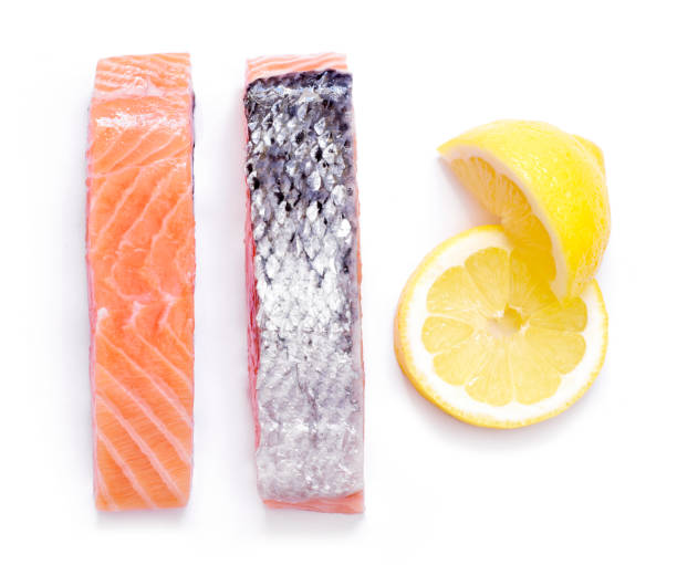 istock Raw salmon fillets, isolated on white background 1216394919