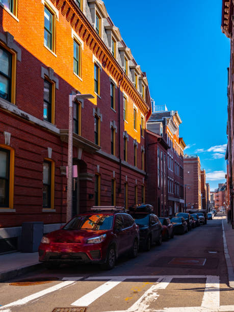 istock Street with red brick buildings on blue sky background 1216396116