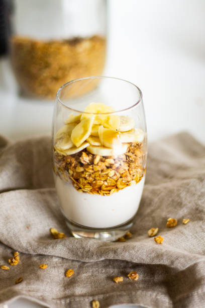 istock A cup of yogurt with muesli and bananas 1216397475