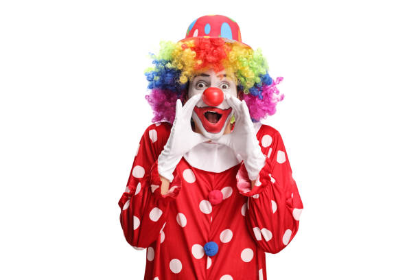 istock Clown in a polka dot red costume shouting 1216398591