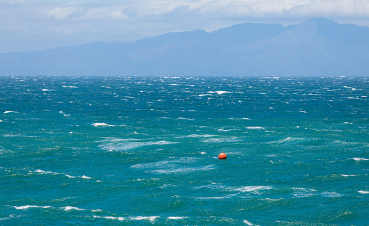 Floating Buoy, Big waves and rough seas on a very windy day in False Bay, Cape Town