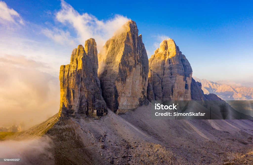 Three Lavaredo Peaks Sunrise of the famous three peaks of Lavaredo, in Dolomites, Italy Tre Cime Di Lavaredo Stock Photo