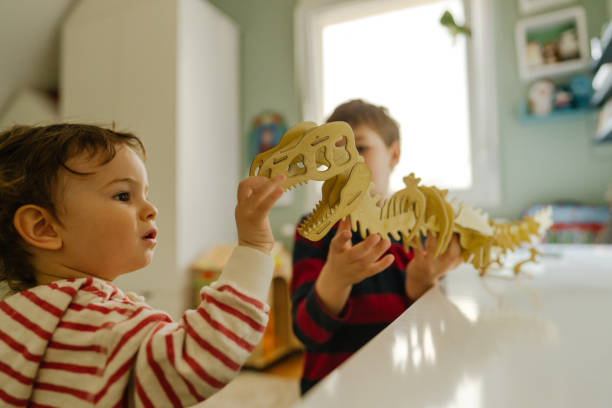 istock Little boys having fun in their room 1216400525