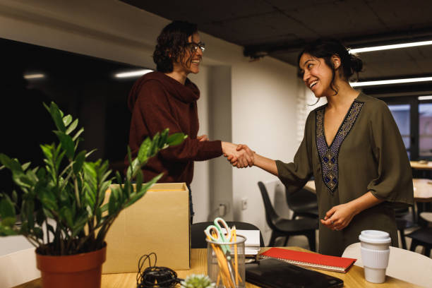 istock Introducing herself to a new  colleague 1216403128